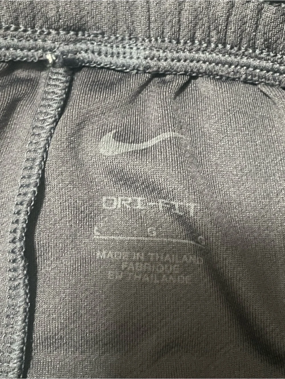 Nike Kids Black Athletic Shorts with Neon Yellow Swoosh